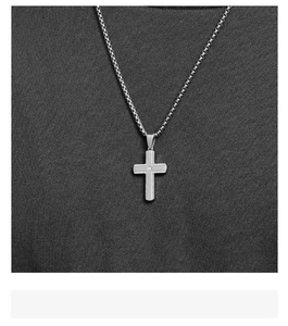 Detailed view of men's stainless steel cross necklace with knurled texture and zircon
