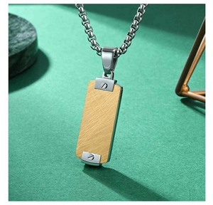 Detailed macro view of industrial rectangle pendant with brushed texture and screw elements