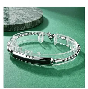 Macro detail of men's faceted stainless steel bracelet with camouflage carbon fiber inlay