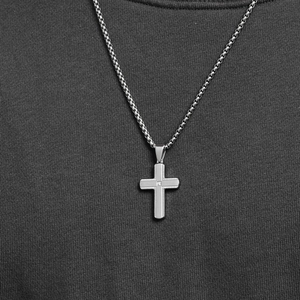Men's stainless steel cross necklace with vertical texture and center crystal on a box chain