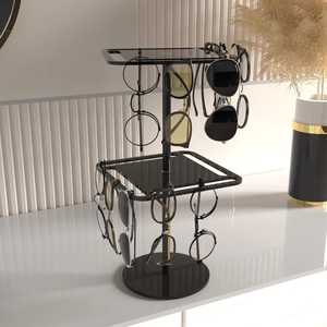 Detail view of double-layer black acrylic rotating sunglasses display rack on countertop