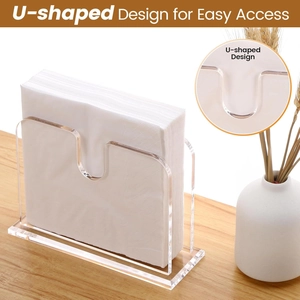 U-shaped acrylic cocktail napkin holder on a wooden table with elegant home decor
