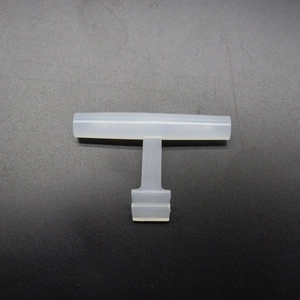 Macro view of a T-shaped translucent acrylic bird feeder perch stand accessory