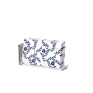 Transparent acrylic guest towel napkin holder with a U-shaped side opening and blue floral napkins