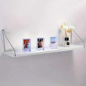 Rainbow acrylic mini photo frame set on a minimalist white shelf with metal brackets