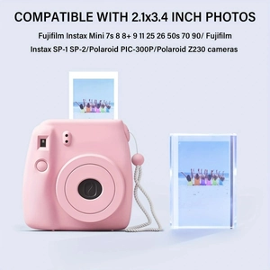 Desktop setup showing acrylic frame with pink camera for 2.1x3.4 inch photos