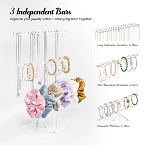 Three-tier clear acrylic jewelry stand for necklaces, bracelets, and hair accessories