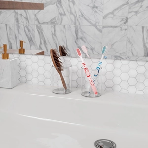 Set of 2 minimalist clear acrylic desk organizers for stationery and brushes on a vanity