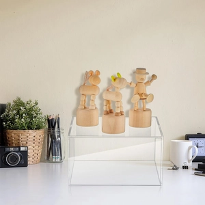 Close-up of clear acrylic display riser showing polished edges and high transparency