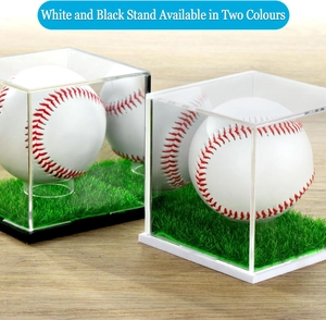 Clear acrylic baseball display cases with black and white bases on wood table