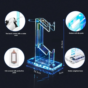 Detail of acrylic game controller stand showing LED light base and cable management system