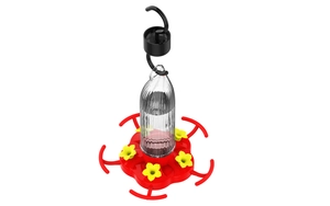 Detail of pumpkin-style hummingbird feeder with yellow flower ports and ant moat hook