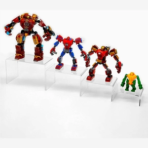 Detailed view of clear acrylic risers displaying toy action figures in tiered levels