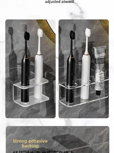 Close-up of wall-mounted clear acrylic electric toothbrush holder with strong adhesive