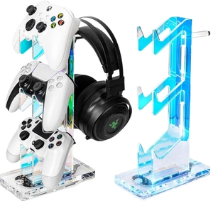 3-tier iridescent acrylic gaming stand holding three controllers and a headset