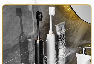 Macro detail of clear acrylic wall mount electric toothbrush holder with dual slots