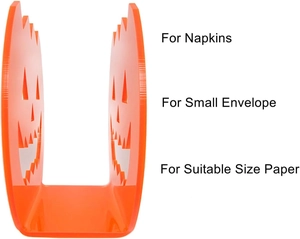U-shaped orange acrylic napkin holder with hollow Halloween pumpkin face design detail