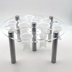 Detailed view of clear acrylic mold holder with sturdy metal support legs and multi-hole design