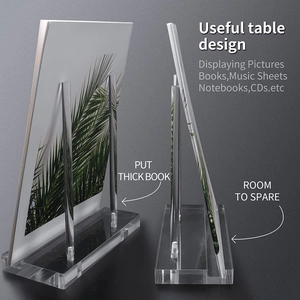 Clear acrylic display stand for books and tablets with a sleek minimalist desktop design