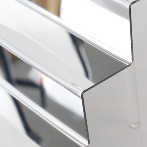Close-up of polished acrylic tier edges on the tiered display stand showing transparency