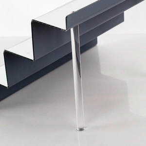 Detail of multi-tier acrylic display stand with black shelves and mirrored finish
