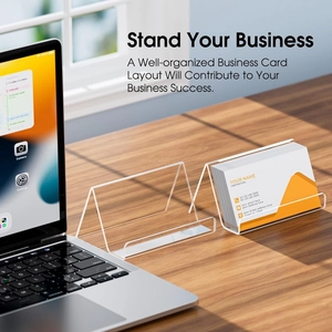 Minimalist clear acrylic business card holder on a wooden desk with triangle stand design