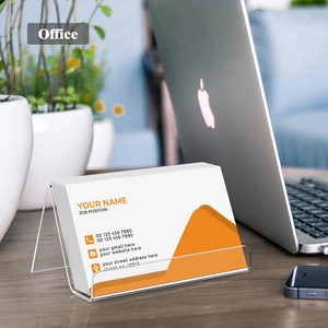 Clear acrylic business card holder with minimalist L-shaped design for office desks