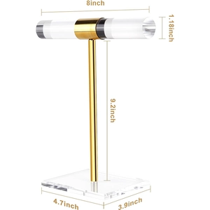Macro view of gold metal jewelry display stand with acrylic bar and base dimensions