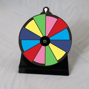 Colorful 12-slot spinning prize wheel with stable black base for party games and promotions