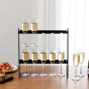 Close-up of a 2-tier black acrylic champagne glass holder for wedding and party displays