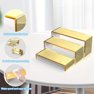 Detail of three-tier gold acrylic risers showing nested storage and polished smooth edges