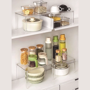 Clear acrylic cabinet organizer shelf for pantry storage and kitchen countertop display