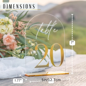 Arch gold acrylic wedding table number 20 sign with elegant floral backdrop