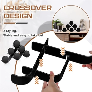 Detail view of the crossover assembly process for a black acrylic hockey puck display stand
