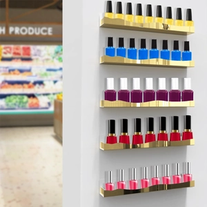 Detailed view of a 5-tier gold floating wall shelf displaying various nail polish bottles