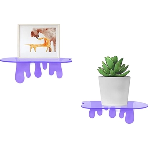 Macro view of purple acrylic floating shelves with unique liquid drip design on wall