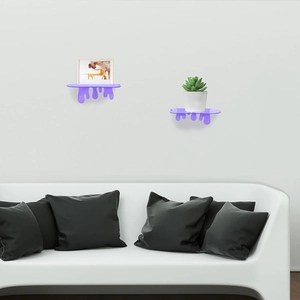 Detail view of purple melting drip acrylic floating wall shelf with small decor