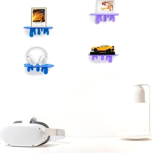 Detail of 7-inch acrylic floating shelves holding a speaker and decorative items on wall