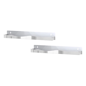 Detail of silver wavy-edge floating shelves with keyhole wall mounting holes