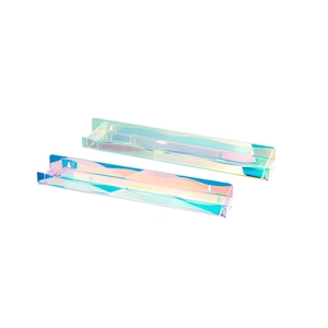 Close-up of floating iridescent acrylic wall shelves set with minimalist U-shaped design