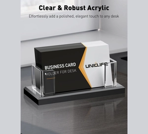 Macro view of clear acrylic business card holder with robust black base for desk storage
