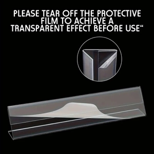 Detail showing removal of protective film on a clear acrylic L-shaped desktop sign holder