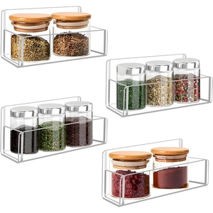 Macro detail of a 9-inch clear acrylic floating bathroom shelf with spice jars