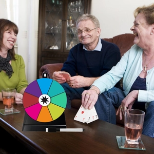Detailed view of an 8-slot colorful tabletop prize wheel with marker for party games