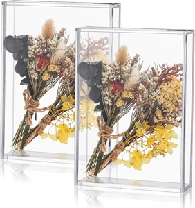 Detail of clear acrylic display boxes with colorful dried flowers and jute rope decor