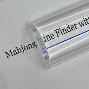 Close-up of 6-inch acrylic bar magnifier with guide line magnifying printed text