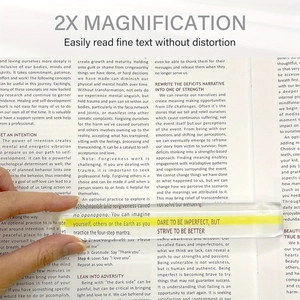 Close-up of 6 inch acrylic bar magnifier with yellow guide line for reading small print