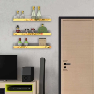 Three-tier wall-mounted gold acrylic storage shelves for cosmetics and collectibles