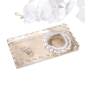 Wavy acrylic vanity tray with wood grain base and silver trim for perfumes and jewelry