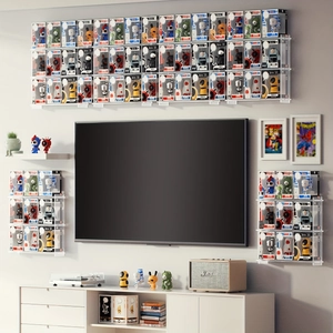 Modern wall-mounted clear acrylic grid display case for collectibles in home setting